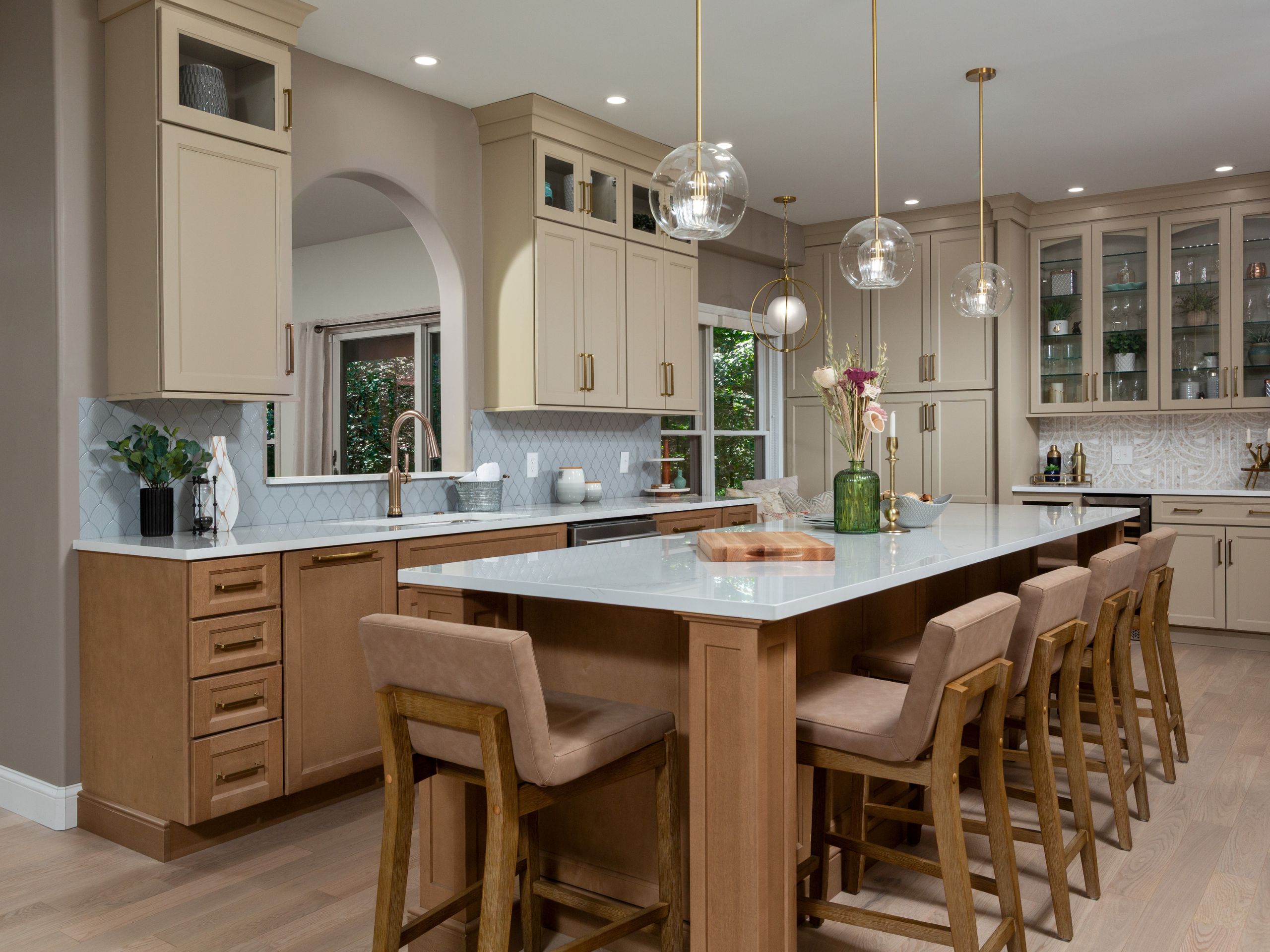 An image of a large custom kitchen island with bar seating